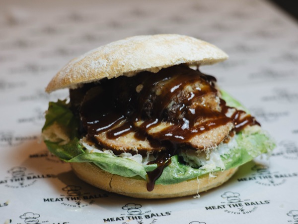 BBQ Glory, meatball sandwich with BBQ sauce, coleslaw and Old Amsterdam cheese.